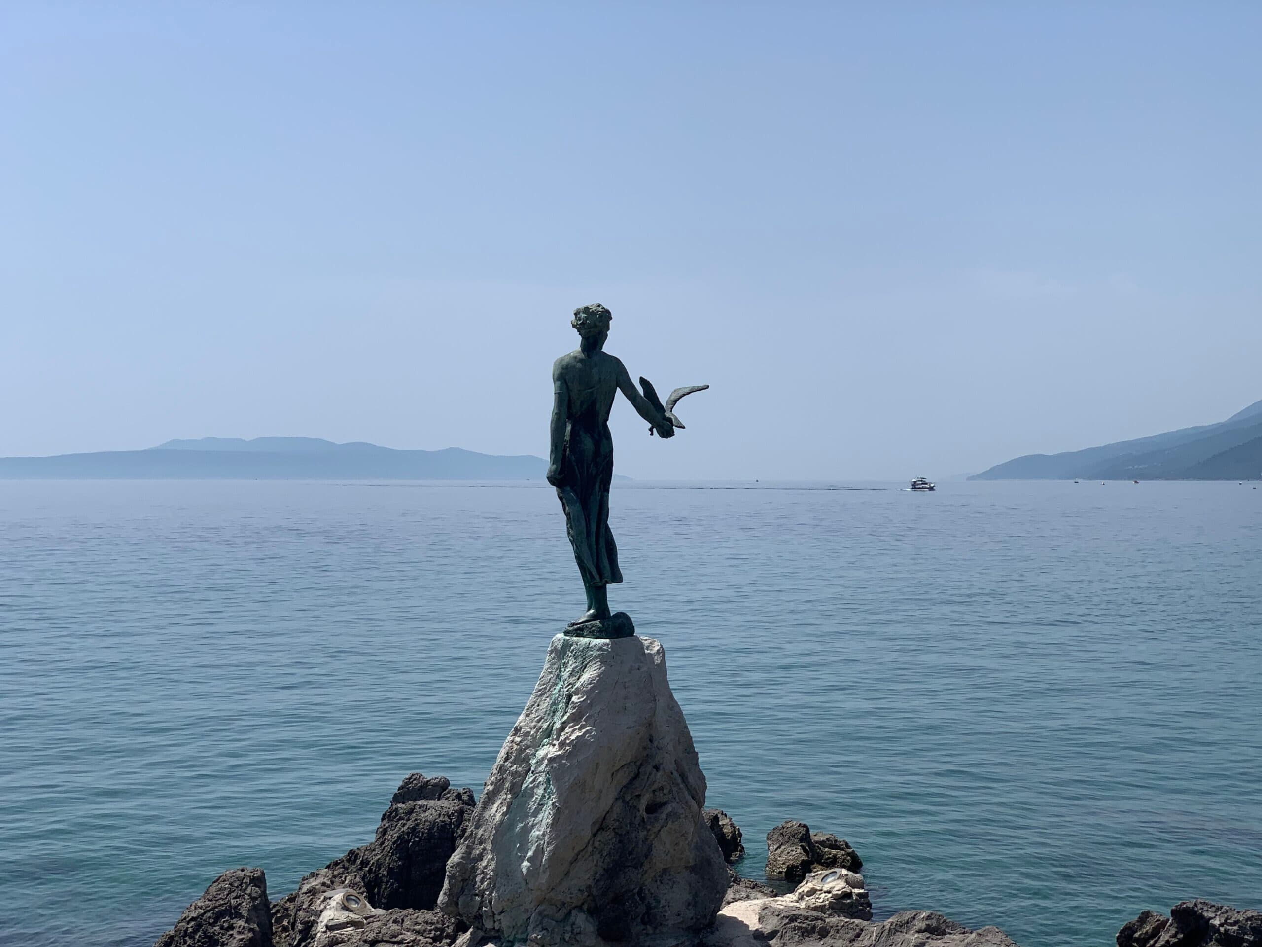 Girl with a seagull in Opatija
